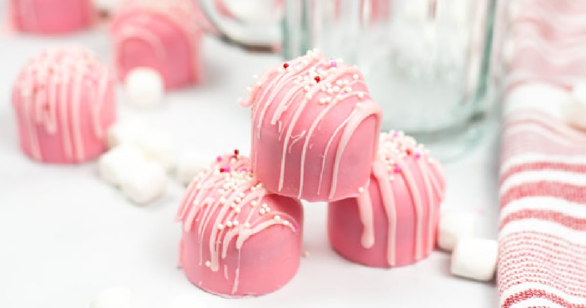 Chocolate cake balls stripped with pink candy melts for Valentines Day  treats. Presented in miniature cupcake liners pink white and red polka dots  on Stock Photo - Alamy