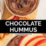 A bowl of chocolate hummus topped with chocolate chunks surrounded by sliced apples.