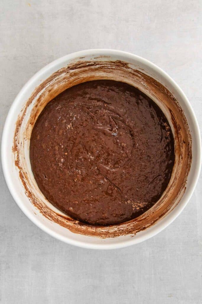 A bowl filled with chocolate batter.